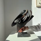 inner-tension-wood-sculpture-hand-scale Abstract wood sculpture held in hand, showing scale and form