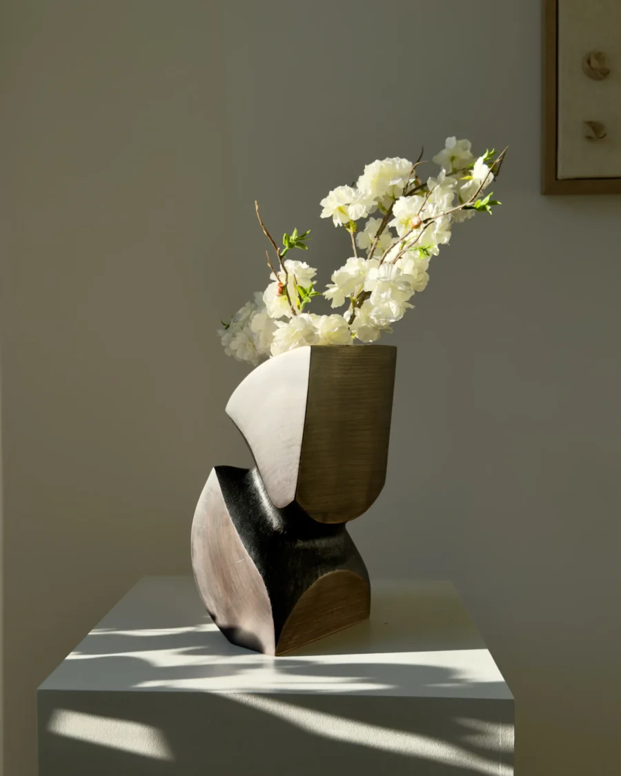 Abstract apple wood vase with organic curved form and yakisugi textured interior