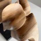 smooth hand carved walnut surface detail