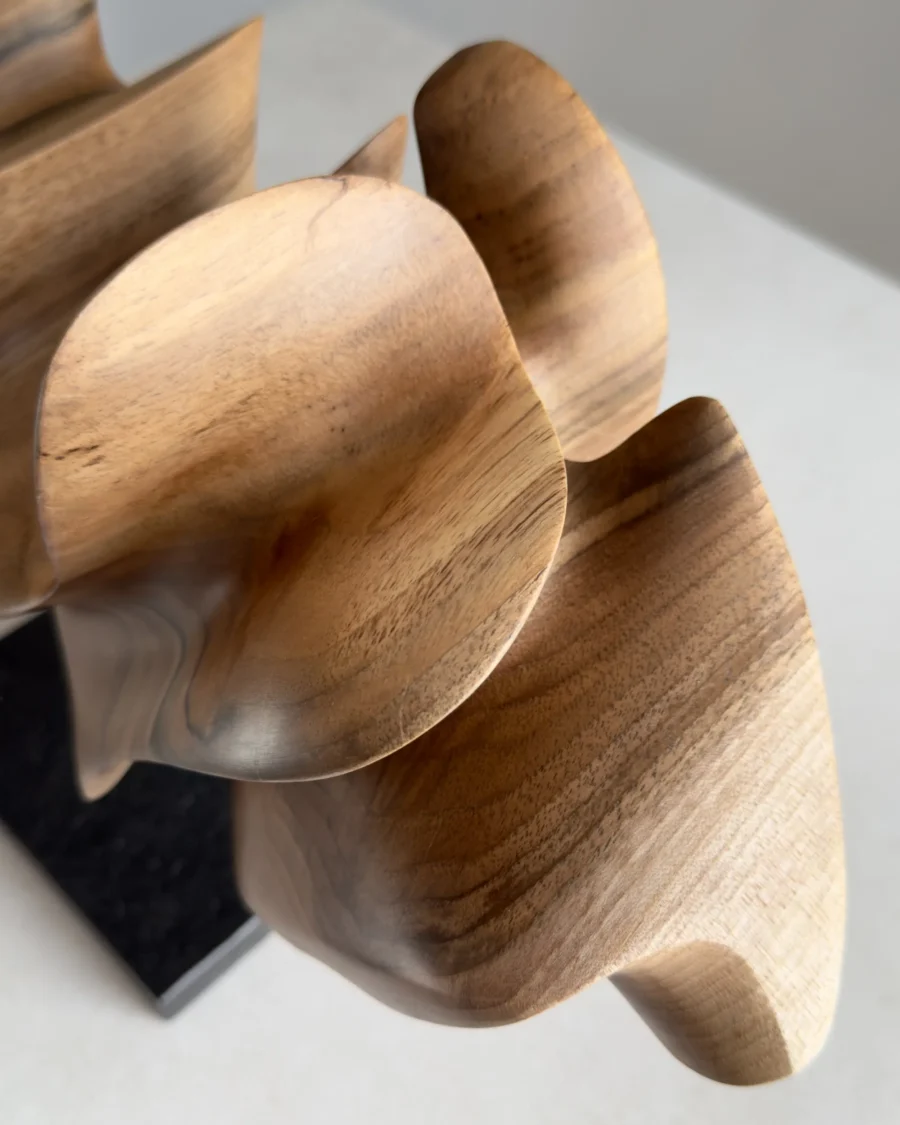 smooth hand carved walnut surface detail