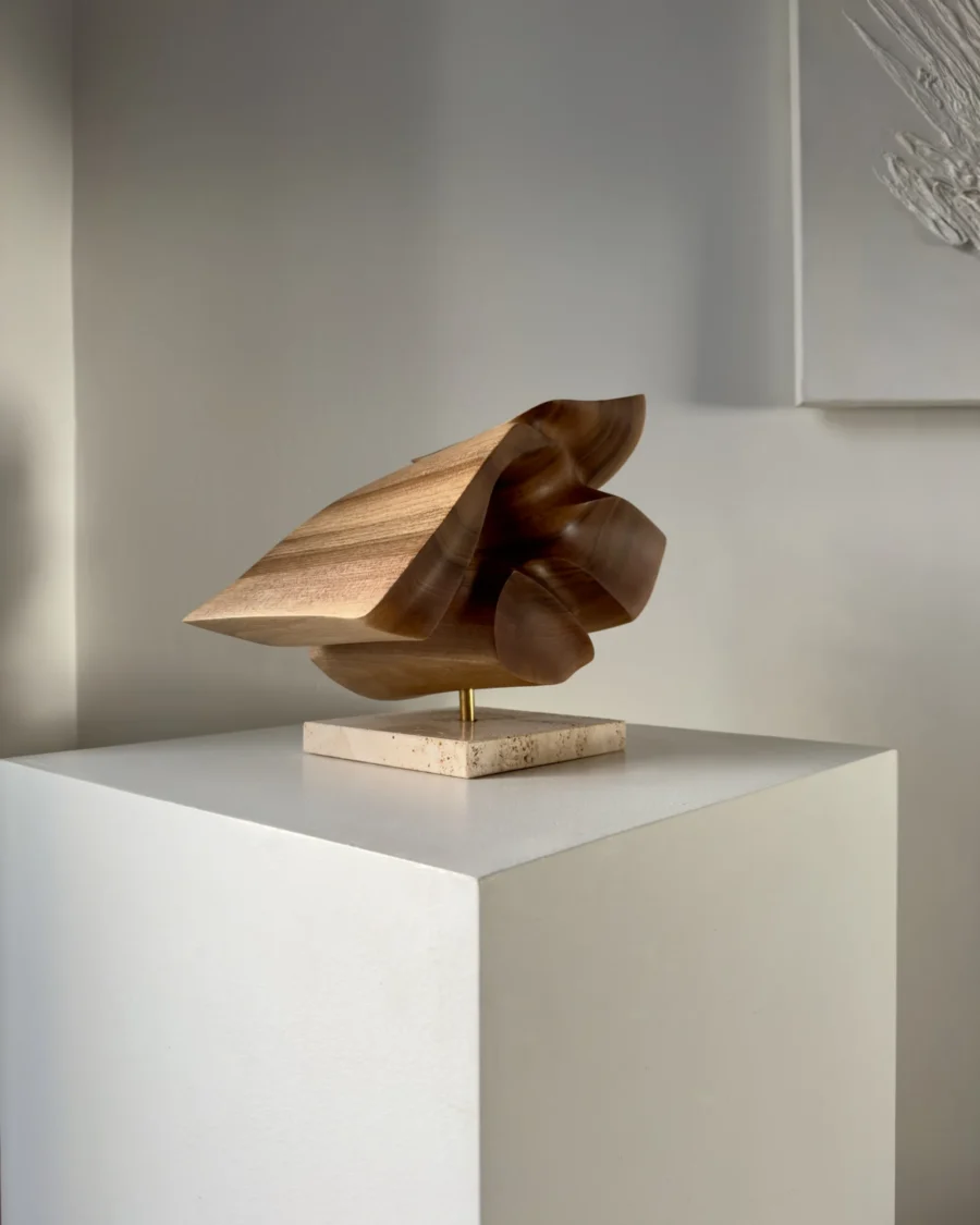 reveris-abstract-wood-sculpture-light-shadow Abstract walnut wood sculpture “Reveris” photographed in minimalist interior with soft light and shadow.
