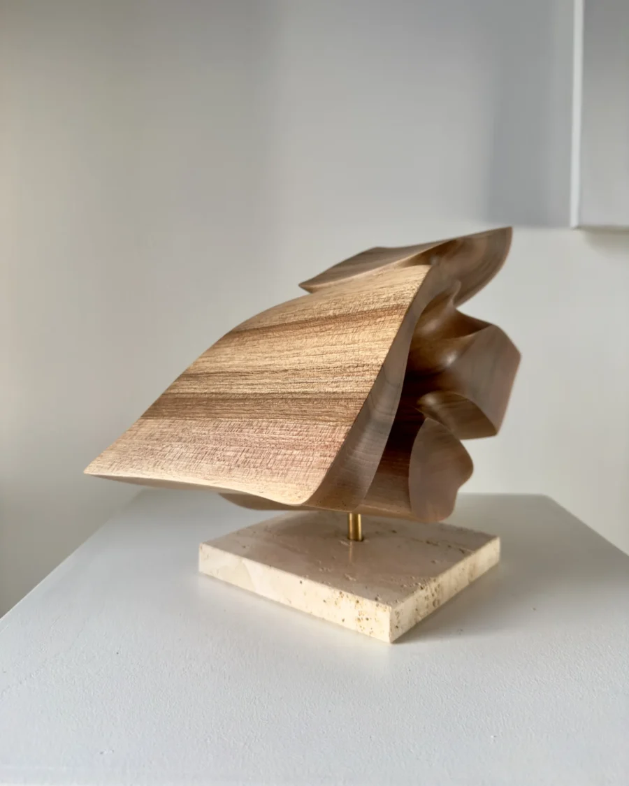 reveris-walnut-sculpture-travertine-base Handmade walnut sculpture “Reveris” mounted on natural travertine base with brass rod support.