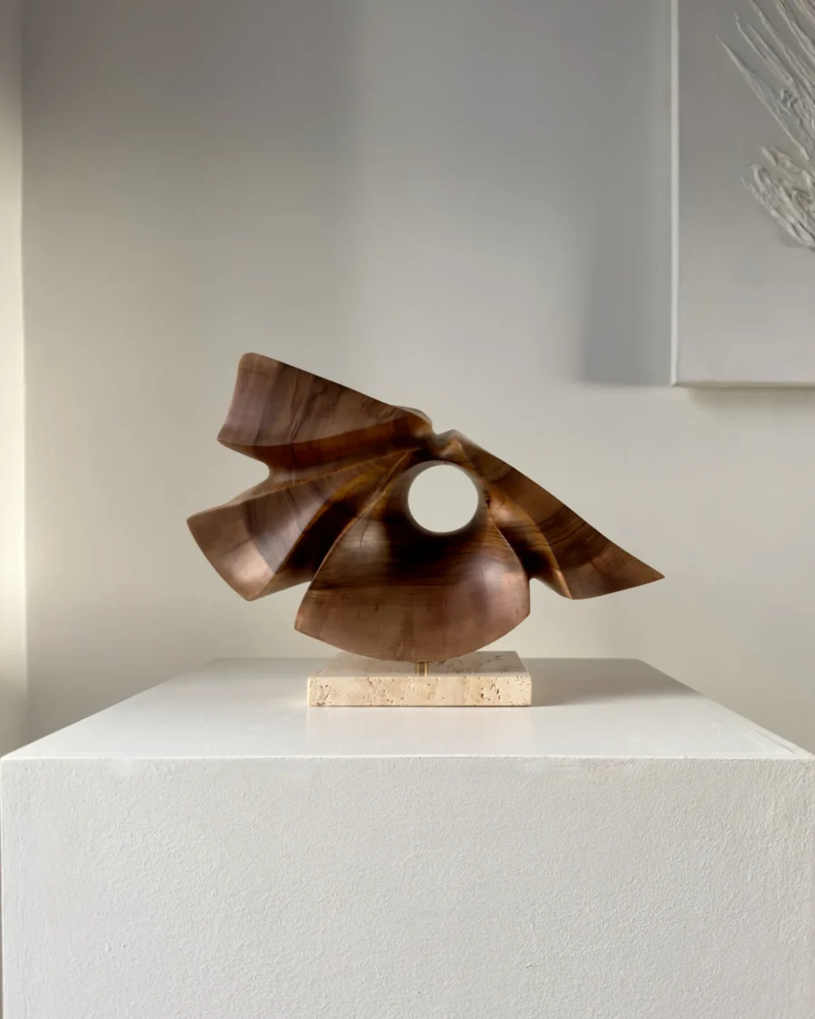 reveris-walnut-wood-sculpture-front-view Hand-carved walnut wood sculpture “Reveris” on travertine base photographed in soft natural light.
