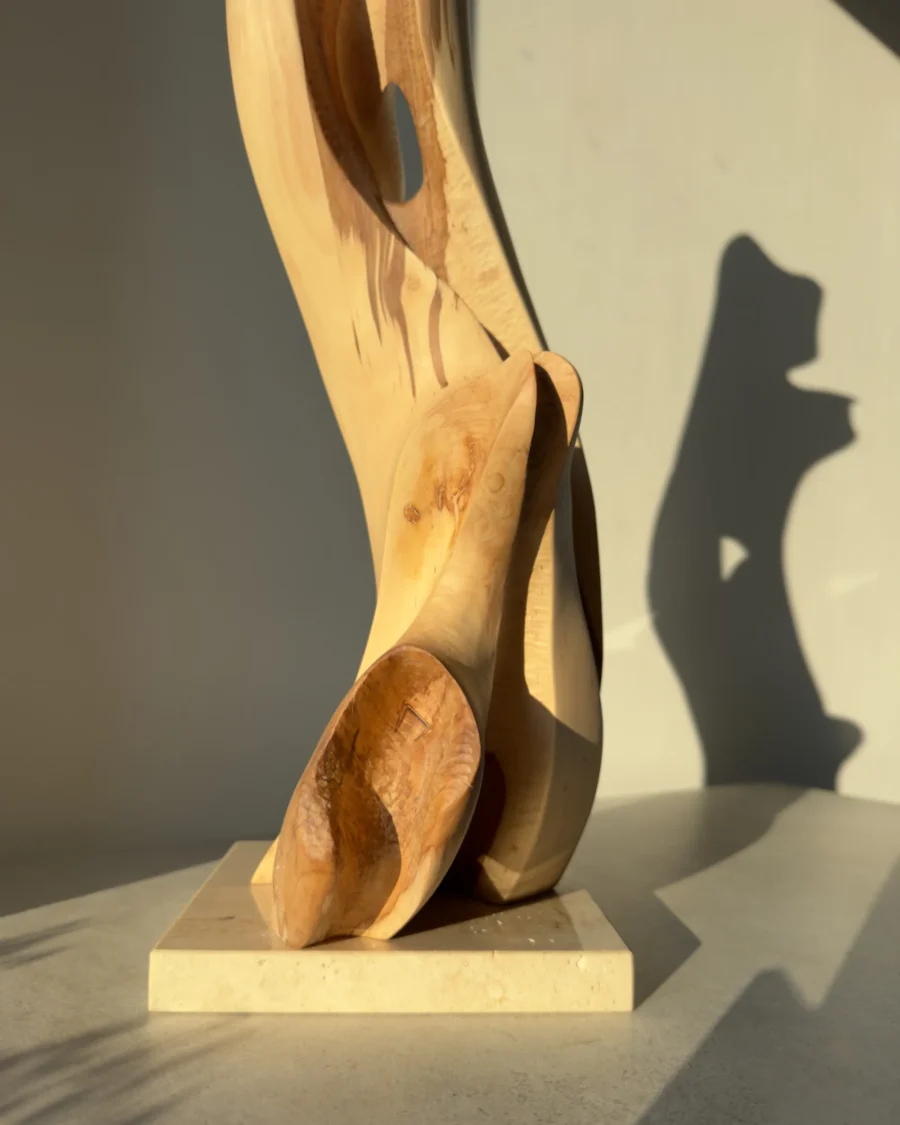 Detail of Rising Form sculpture showing smooth applewood grain and carved interior forms