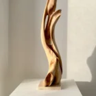 Rising Form contemporary wooden sculpture displayed in natural sunlight
