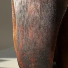 Solid walnut vase with fire-charred finish and tactile brushed texture