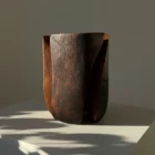 Wabi sabi walnut wood vase with deep black finish and warm brown undertones