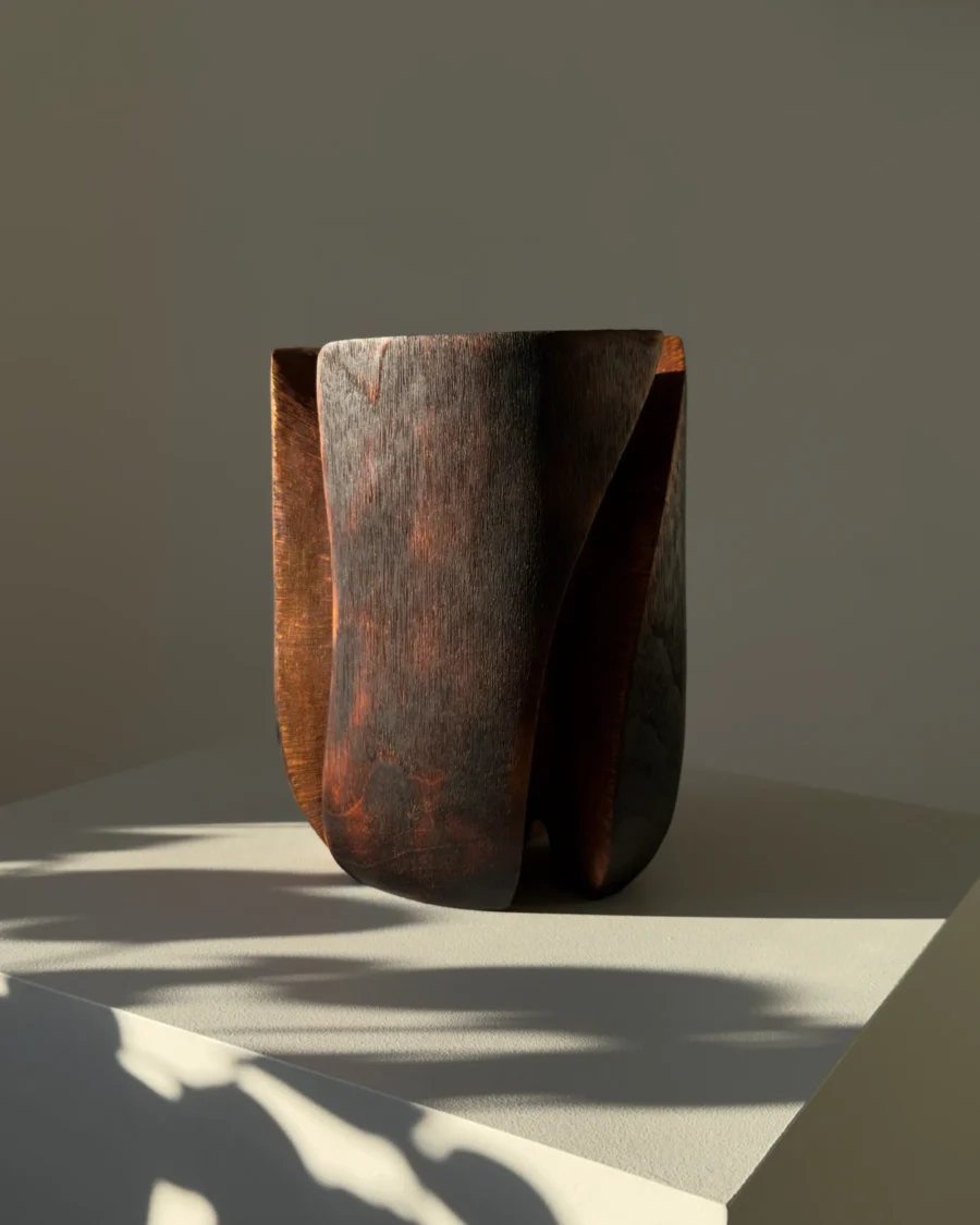 Wabi sabi walnut wood vase with deep black finish and warm brown undertones