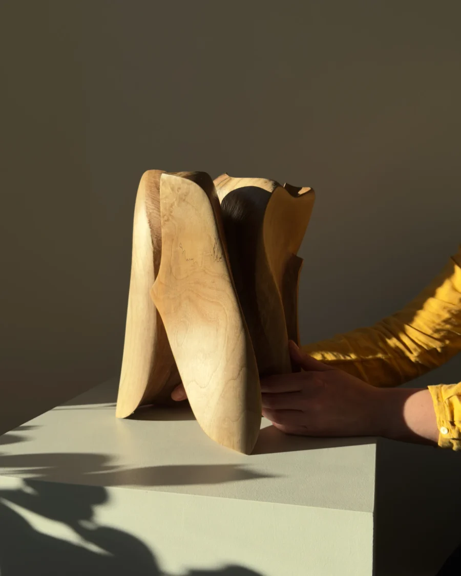 threefold-balance-handmade-walnut-sculpture-scale 2 Artist holding large hand carved walnut sculpture to show scale and craftsmanship