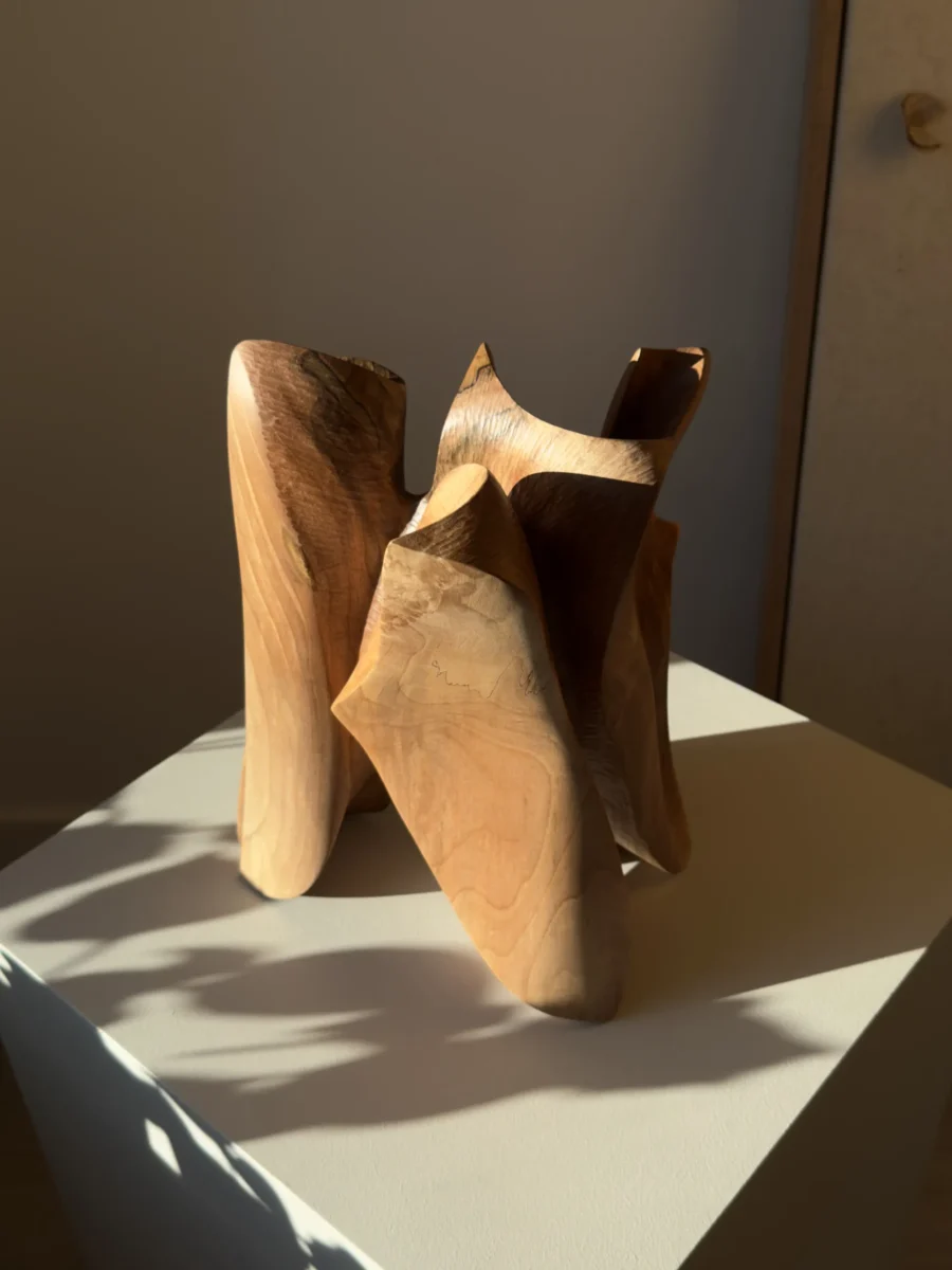 threefold-balance-japandi-wood-sculpture Sculptural walnut wood object with interconnected flowing forms and open negative spaces
