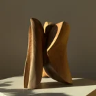 threefold-balance-organic-wood-sculpture-back-view Modern hand carved wood sculpture with flowing organic curves made from solid walnut wood