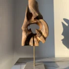 through-the-light-walnut-sculpture-soft-light Hand carved walnut wood sculpture Through the Light in minimalist interior with soft evening light