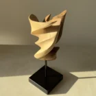 Breath of Fire contemporary walnut sculpture balancing movement and stillness