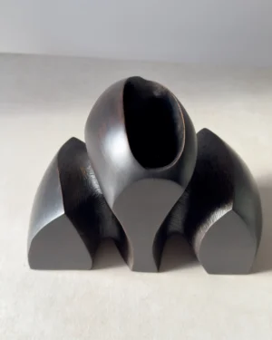 Gathering hand carved cherry wood vase with yakisugi finish viewed from the side