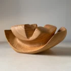 Side view of Memory Lines hand-carved cherry wood ikebana vase revealing layered organic forms