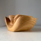 Abstract cherry wood sculptural vase with flowing curves and preserved natural cracks filled with light resin