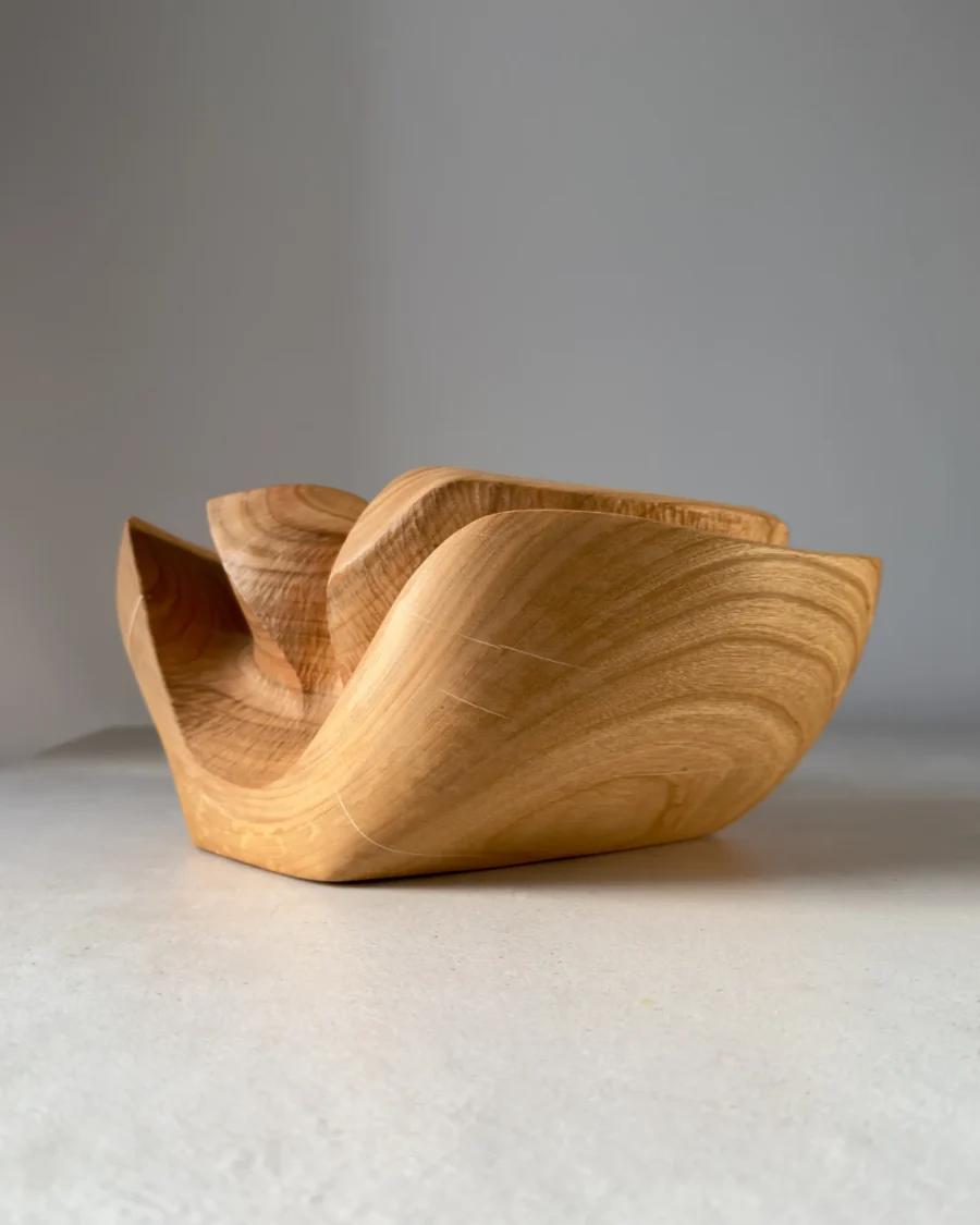 Abstract cherry wood sculptural vase with flowing curves and preserved natural cracks filled with light resin