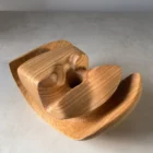 Close-up top view of Memory Lines wooden ikebana vase highlighting grain direction and carved contours
