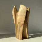 quiet-bloom-walnut-vase-back-view Close view of walnut wood grain and smooth hand finished surface on sculptural vase