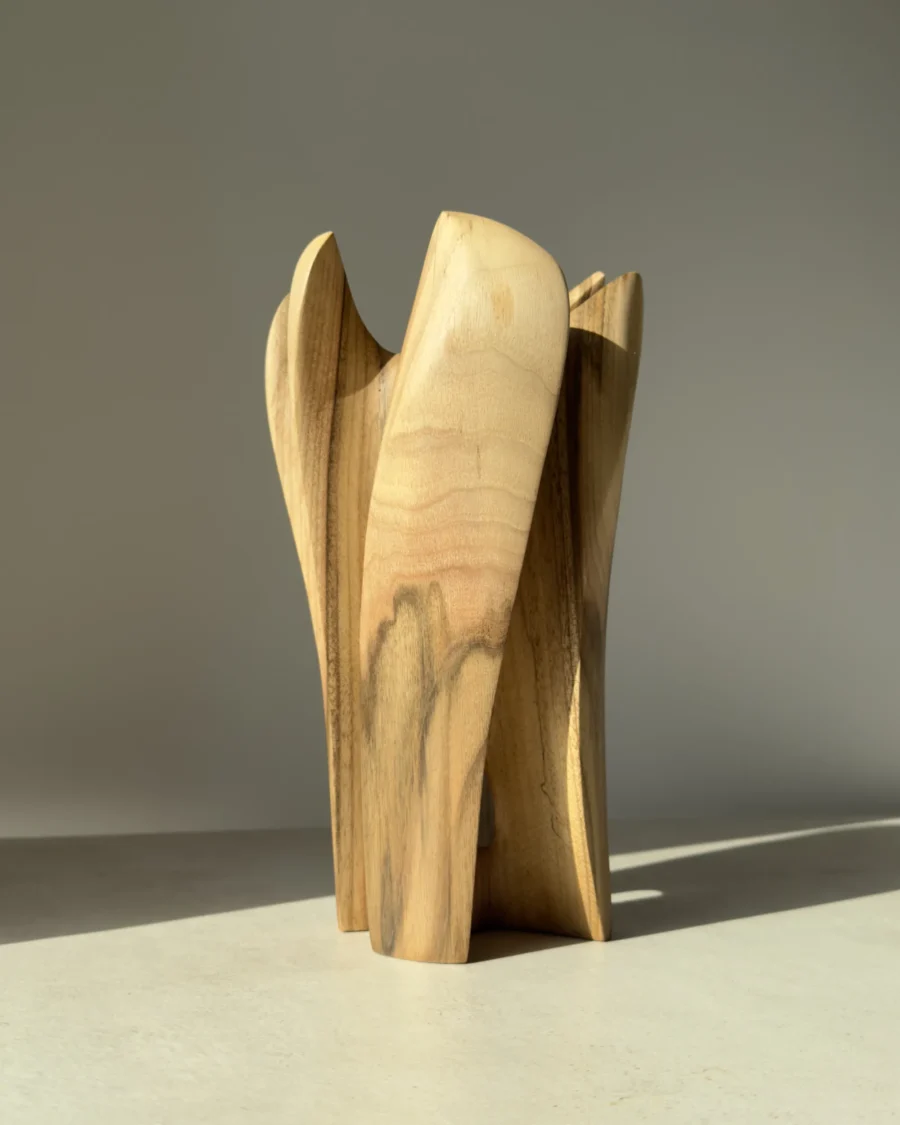 quiet-bloom-walnut-vase-back-view Close view of walnut wood grain and smooth hand finished surface on sculptural vase