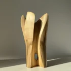quiet-bloom-wood-vase-side-view Organic wooden art vase carved from walnut with elegant vertical forms and natural finish