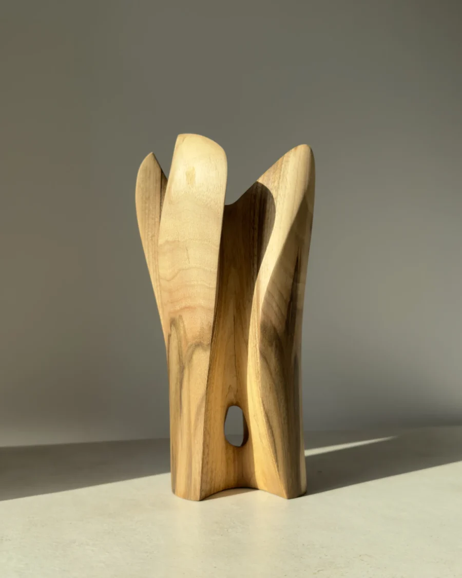 quiet-bloom-wood-vase-side-view Organic wooden art vase carved from walnut with elegant vertical forms and natural finish