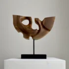 quiet-span-walnut-wood-sculpture-back-view Back view of Quiet Span abstract walnut wood sculpture highlighting its carved openings and natural walnut grain.