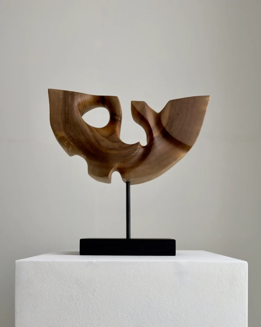 quiet-span-walnut-wood-sculpture-back-view Back view of Quiet Span abstract walnut wood sculpture highlighting its carved openings and natural walnut grain.