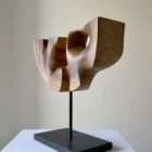 quiet-span-walnut-wood-sculpture-left-side Left side view of Quiet Span hand-carved walnut wood sculpture showing its sculptural depth and organic form.
