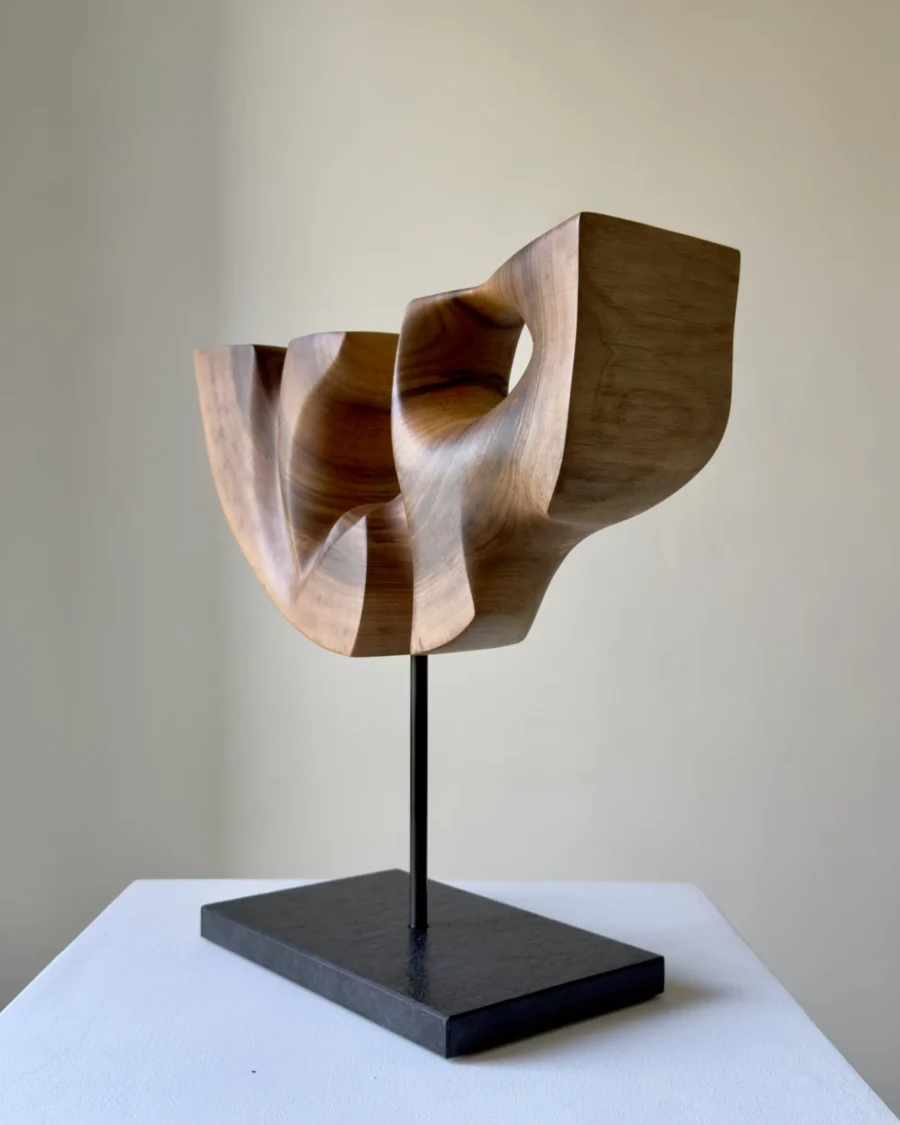 quiet-span-walnut-wood-sculpture-left-side Left side view of Quiet Span hand-carved walnut wood sculpture showing its sculptural depth and organic form.