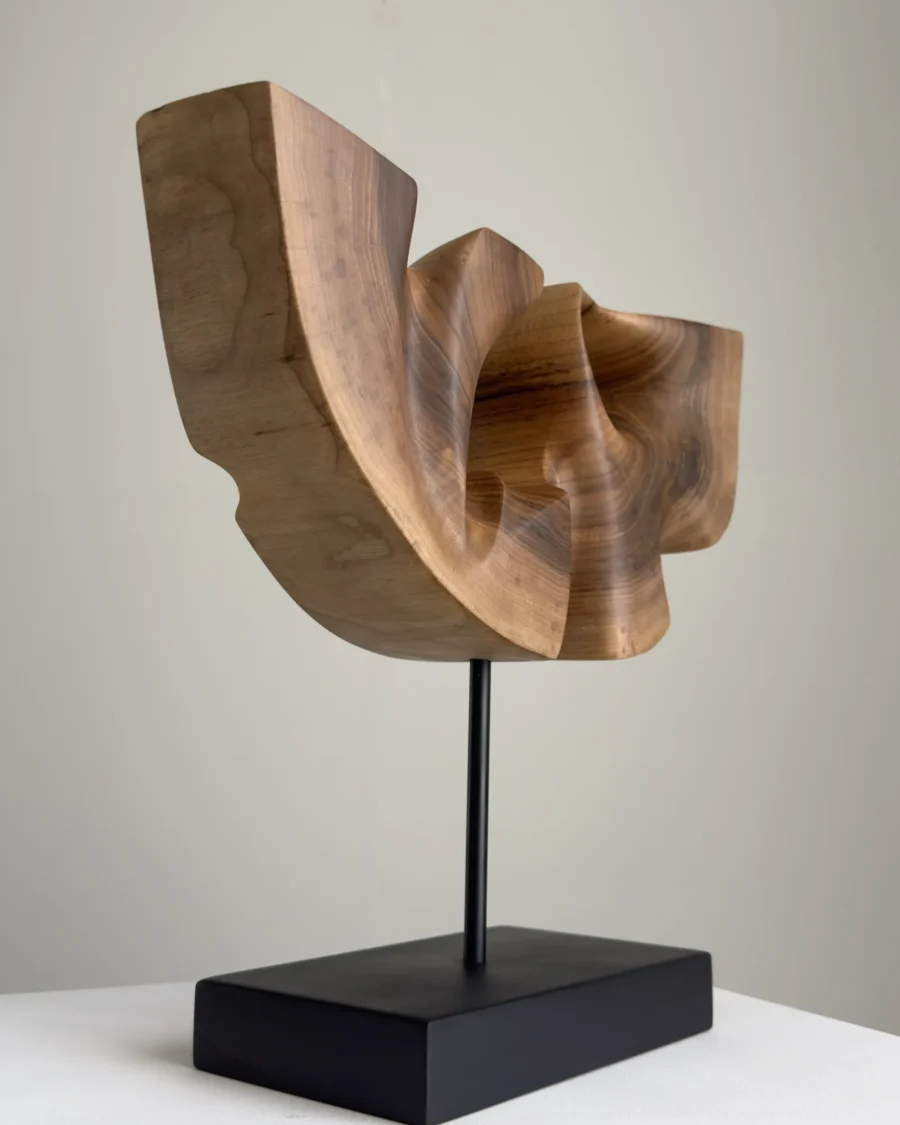 quiet-span-walnut-wood-sculpture-right-side Right side view of Quiet Span walnut wood sculpture emphasizing the flowing transitions of the carved form.