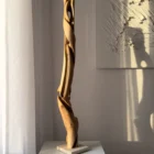 silent-axis-sculpture-side-profile Side profile of Silent Axis hand carved walnut sculpture showing flowing vertical lines and openings