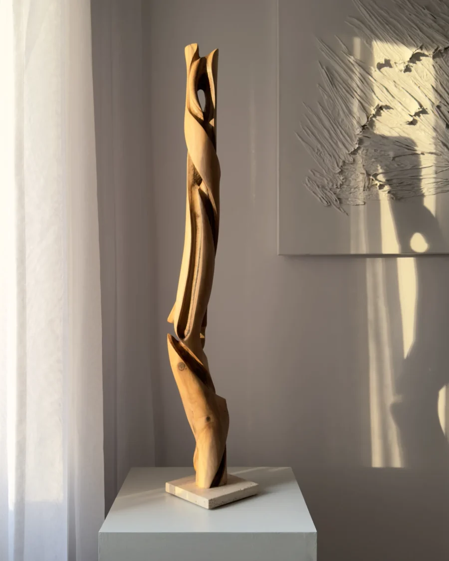 silent-axis-sculpture-side-profile Side profile of Silent Axis hand carved walnut sculpture showing flowing vertical lines and openings