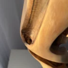 silent-axis-walnut-grain-detail Close-up of Silent Axis sculpture highlighting natural walnut grain and smooth hand carved surface