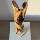silent-axis-walnut-sculpture-top-view Top view of Silent Axis hand carved walnut wood sculpture revealing flowing openings and organic interior forms