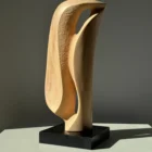 Textured carving detail of Veil of Air apple wood artwork