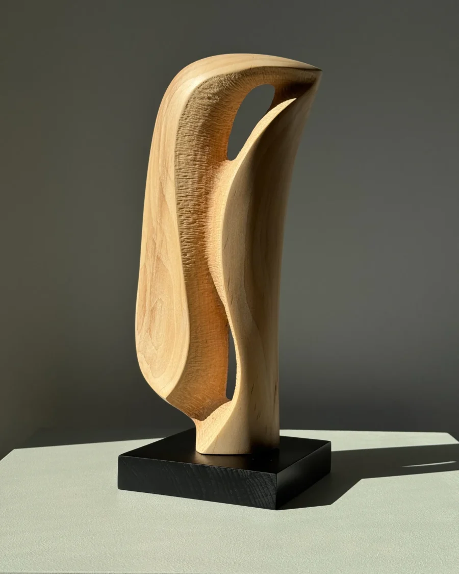 Textured carving detail of Veil of Air apple wood artwork