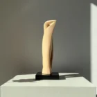 Contemporary apple wood sculpture with organic flowing form