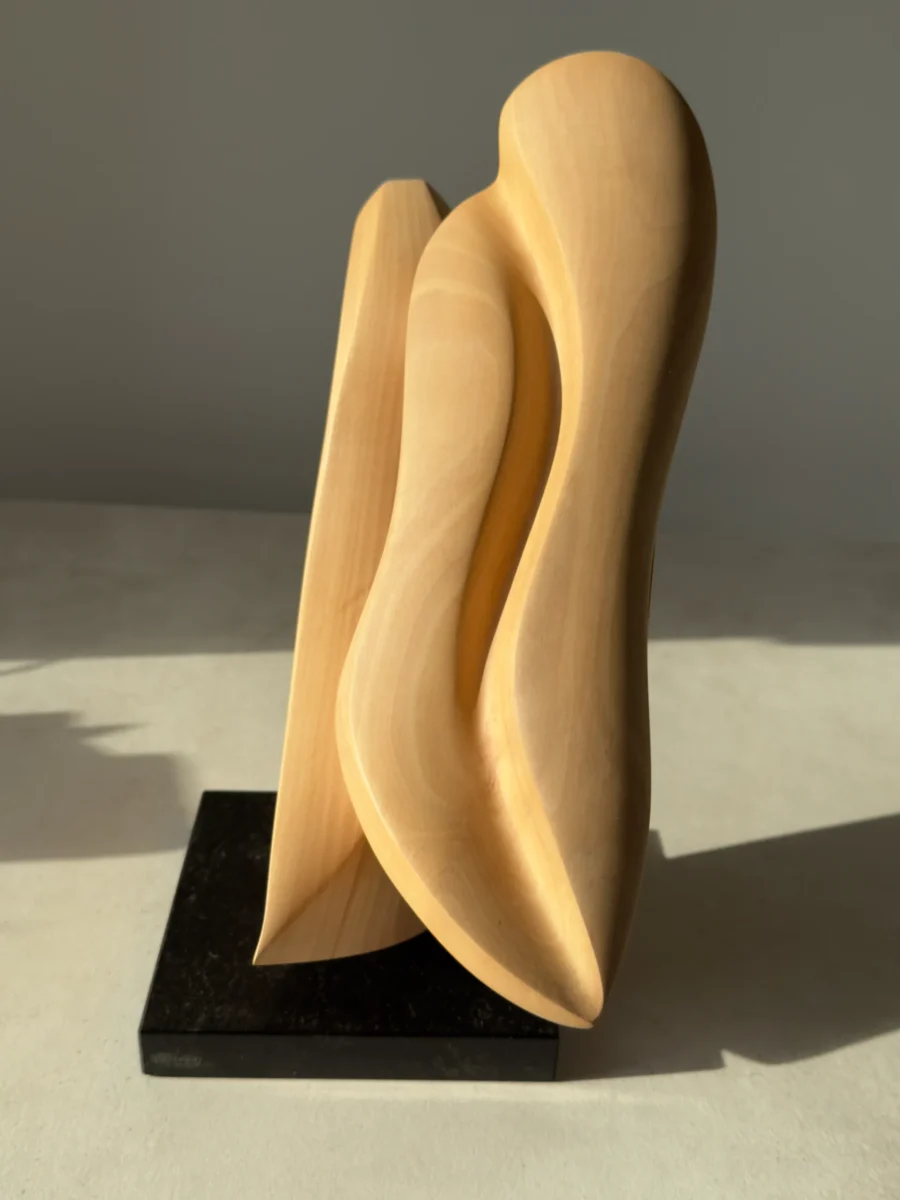 Close-up of the smooth hand-finished apple wood surface highlighting the natural grain and subtle colour variations.