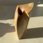 Close elevated view of Continuum showing the carved opening and the meeting of curved and angular planes.