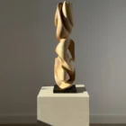 Different perspective of the Convergence sculpture showing the natural contrast of walnut wood.