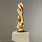 Front view highlighting the balanced relationship between the sculpture's organic forms.