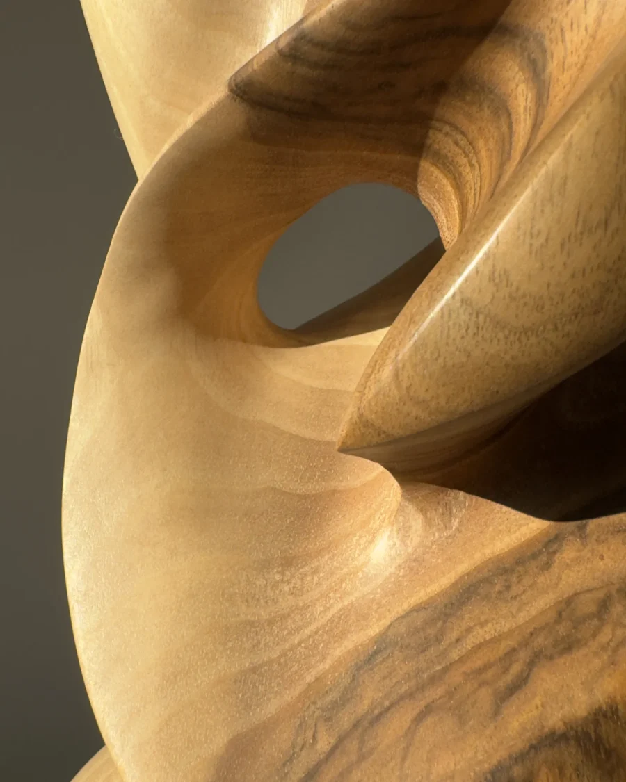 Close-up revealing the natural transition from warm beige to deep brown walnut grain.