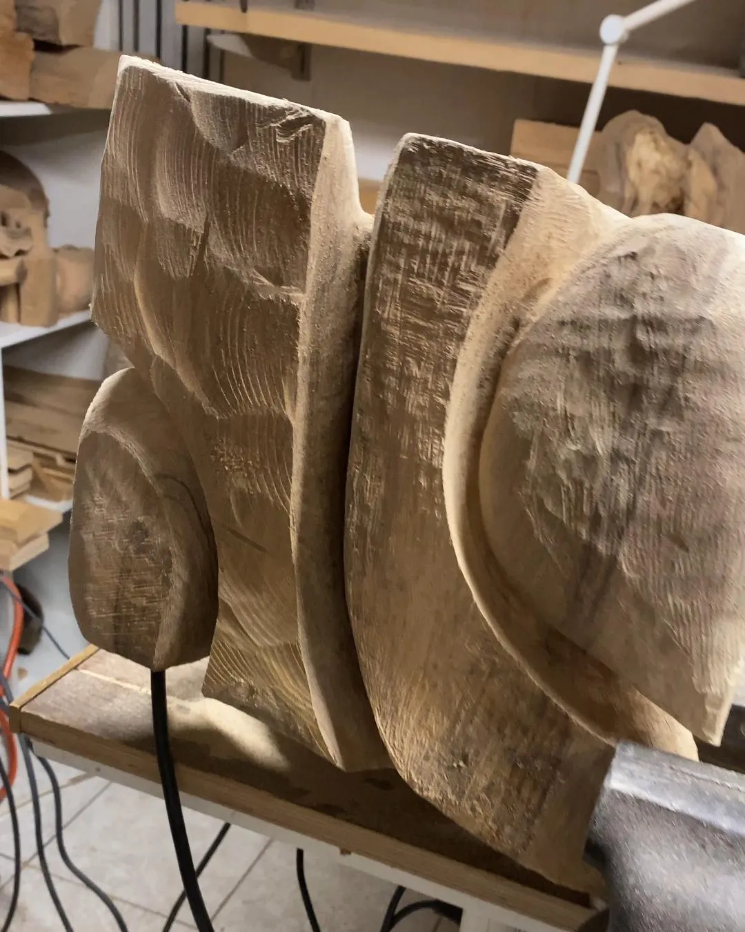Developing the organic form of Folded Presence while following the natural grain of the walnut.
