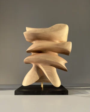 Back view of Fluens highlighting smooth layered planes, flowing silhouette and natural walnut texture.