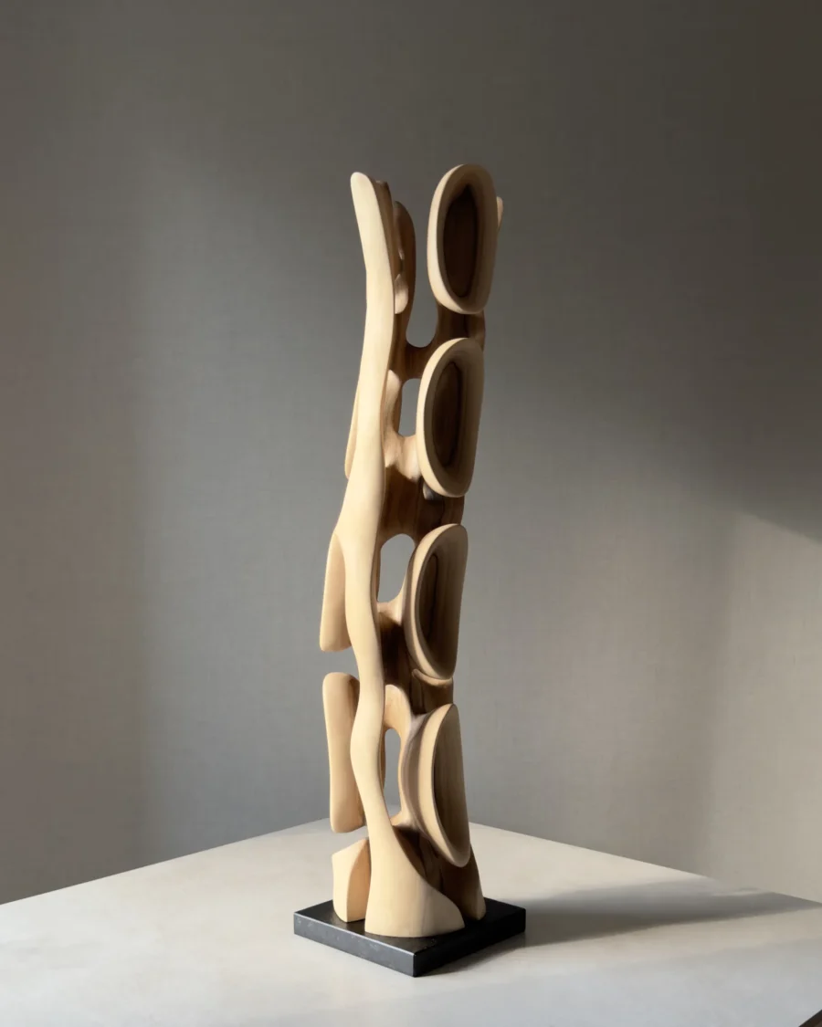 Rear view of Ivory Flow showing the relationship between carved openings, grain and natural walnut tones.