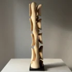 Opposite side view of Ivory Flow highlighting the sculptural rhythm, flowing curves and changing grain of European walnut.