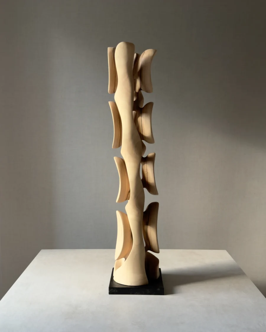 Opposite side view of Ivory Flow highlighting the sculptural rhythm, flowing curves and changing grain of European walnut.