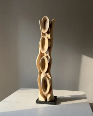 ivory-flow-walnut-sculpture-opposite-side Ivory Flow contemporary walnut sculpture with changing light and shadow across its organic carved forms.