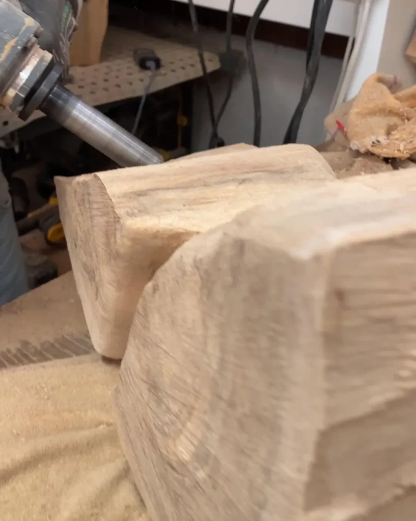 Early shaping of the walnut sculpture Confluence as its form begins to emerge.
